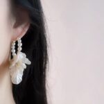 S925 sterling silver earrings with pearl petals are gentle and retro white. They are perfect for daily outings and paired with long dresses, exuding a refined and elegant charm. - Image 5